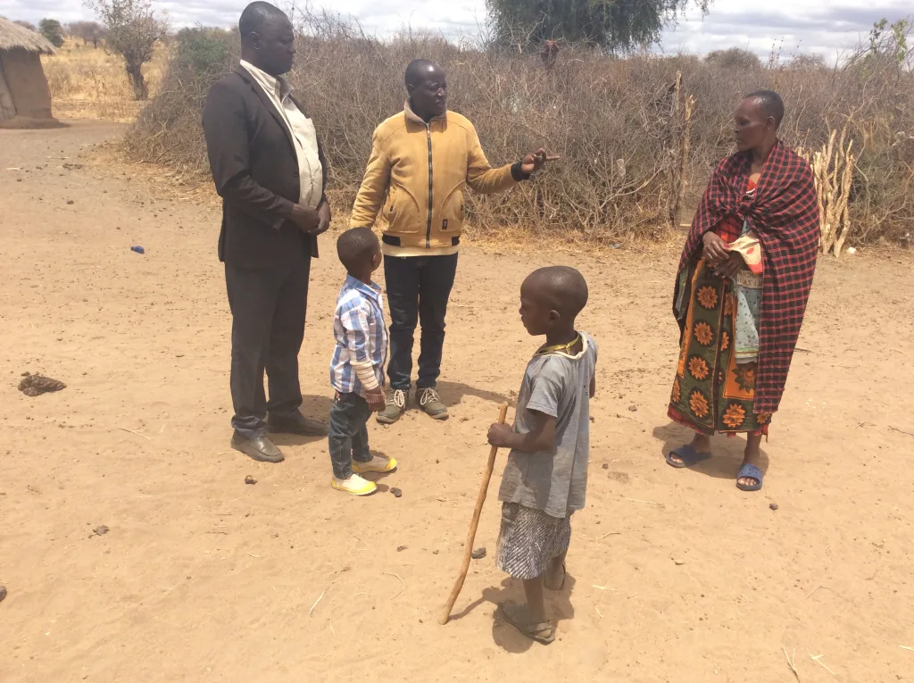 SVTa team members consult participating households on project progress, hive management challenges and future support needs.
